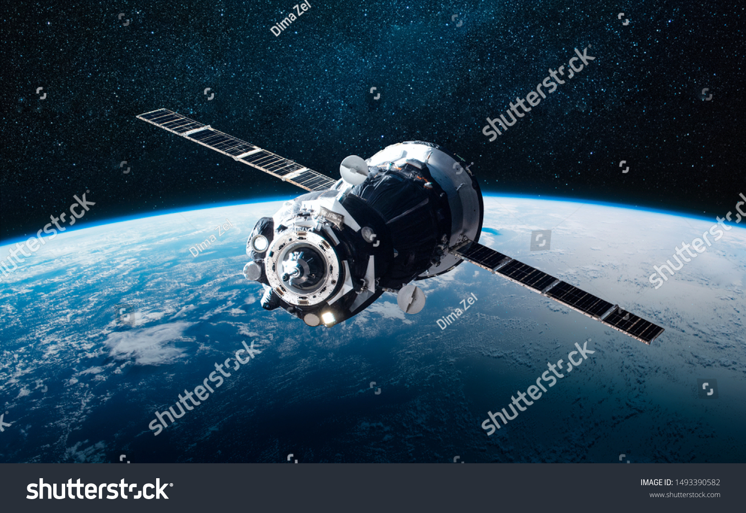 Cargo space craft and Earth planet. Dark background. Sci-fi wallpaper. Elements of this image furnished by NASA #1493390582