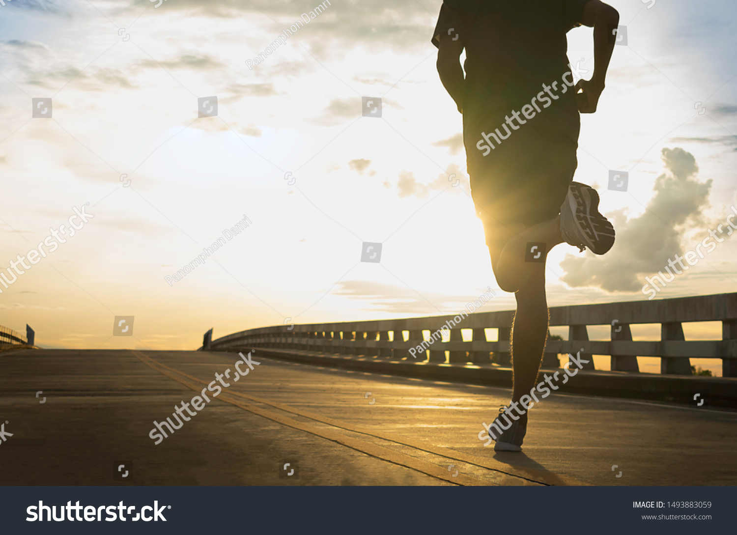 Man running jogging on bridge road. Health activities, Exercise by runner. #1493883059