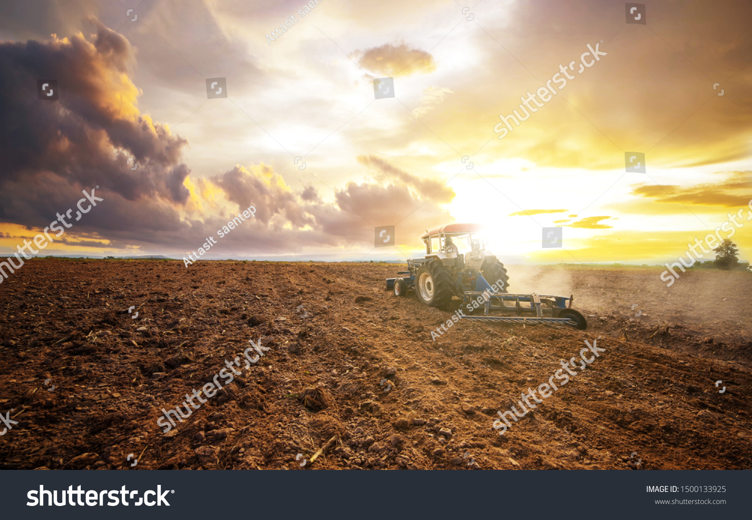 Agricultural industry tractors machinery tools plow large areas soil preparation and reducing labor costs.Agricultural analyst plan production food processing meet increasing consumption concept #1500133925