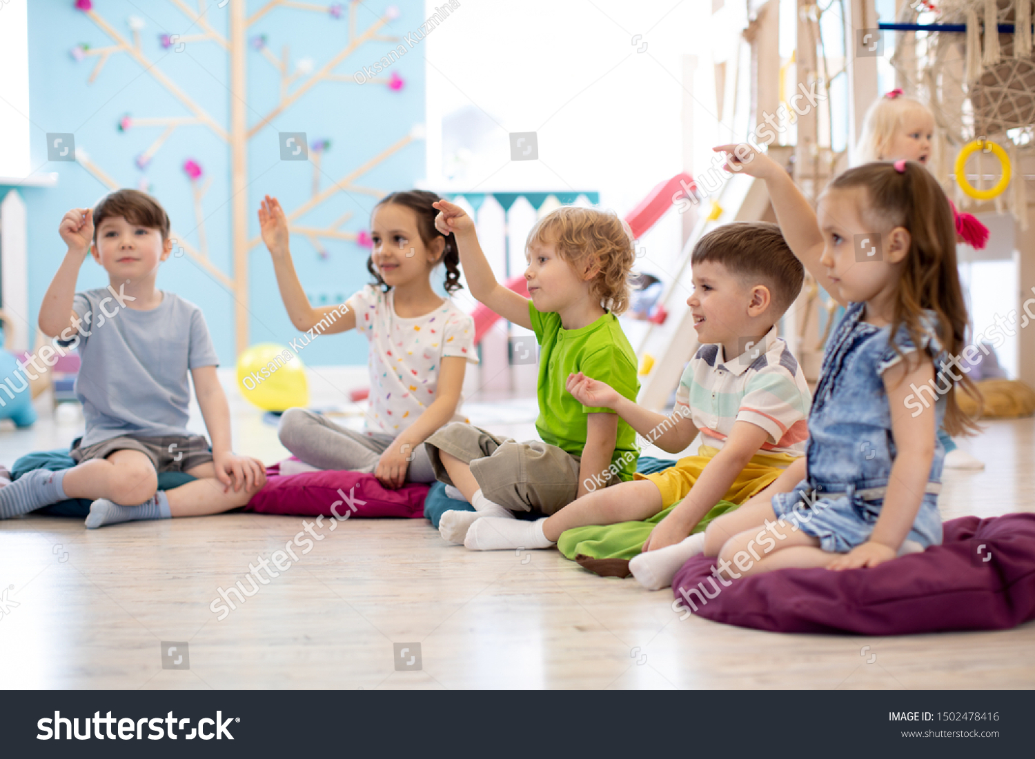 Preschool children play on speech therapy lesson in kindergarten or primary school #1502478416