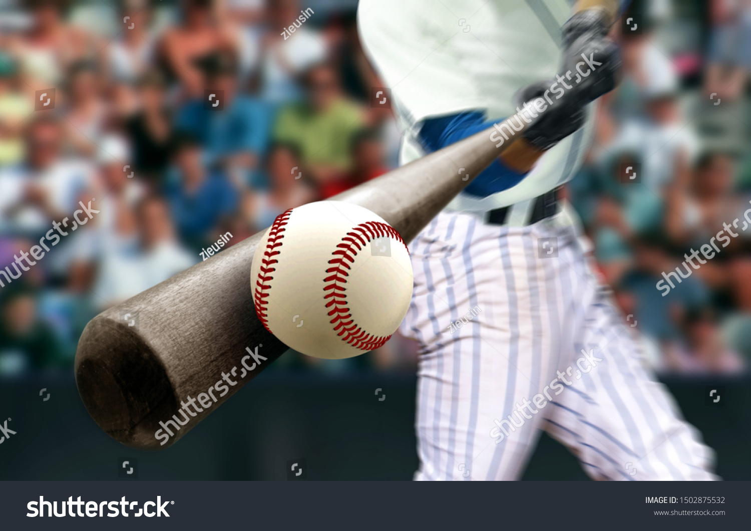 Baseball player hitting ball with bat in close up #1502875532