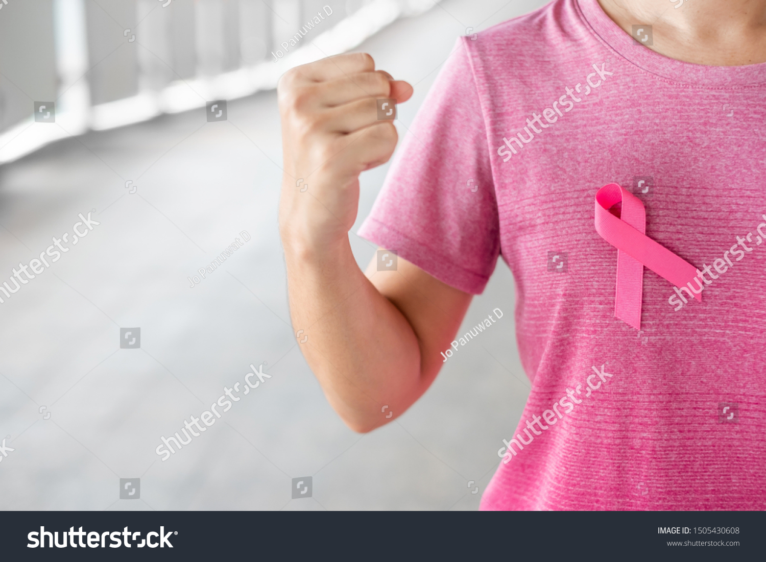 October Breast Cancer Awareness month, Woman in pink T- shirt with Pink Ribbon for supporting people living and illness. Healthcare, International women day and World cancer day concept #1505430608