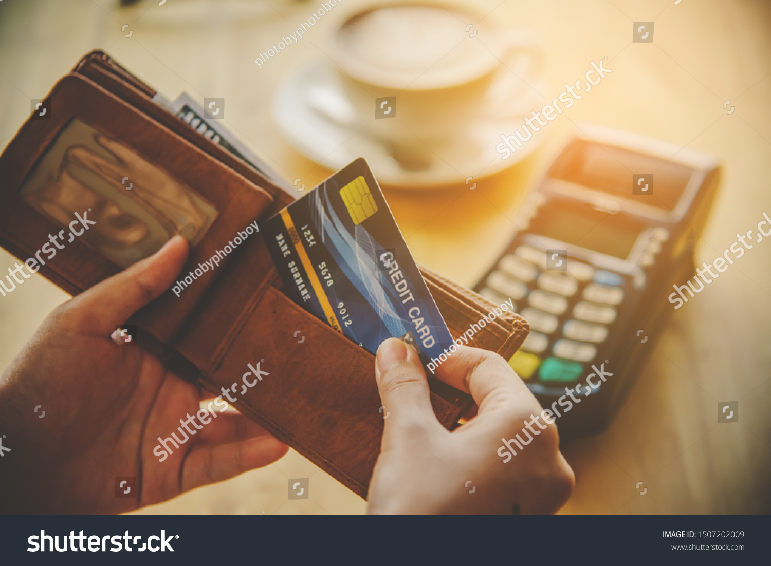 Close up of hand hold credit card to pay. Online payment . Paying by credit card #1507202009