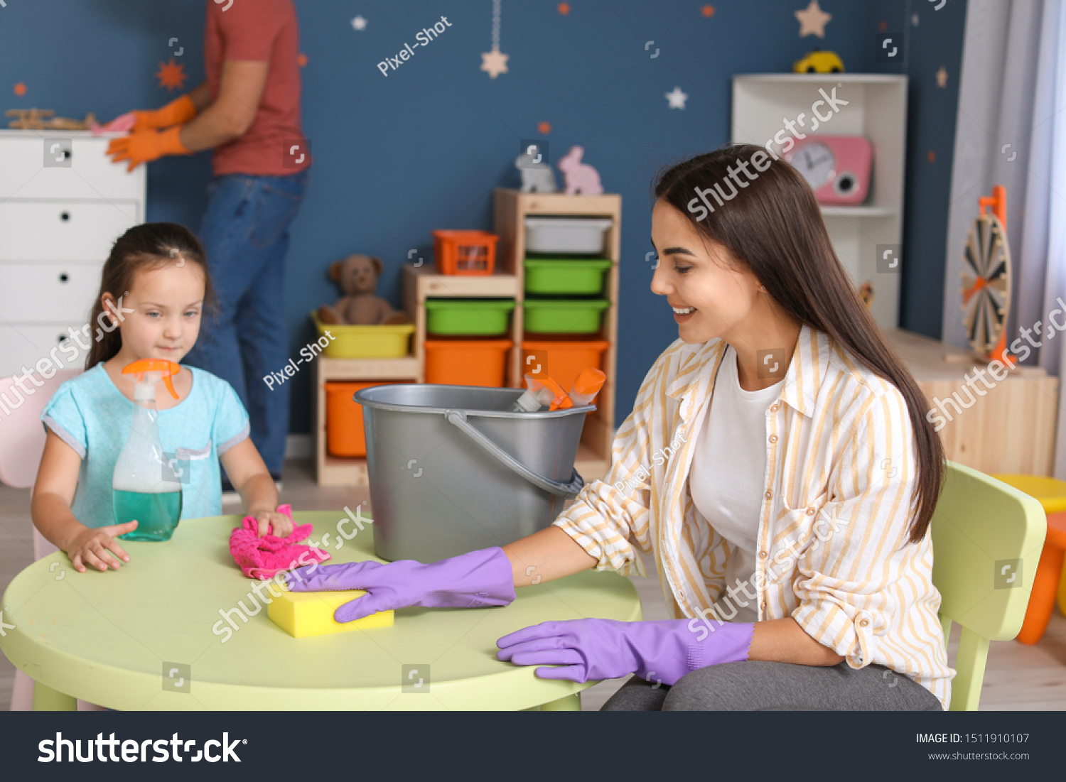 Little girl cleaning her room with mother #1511910107