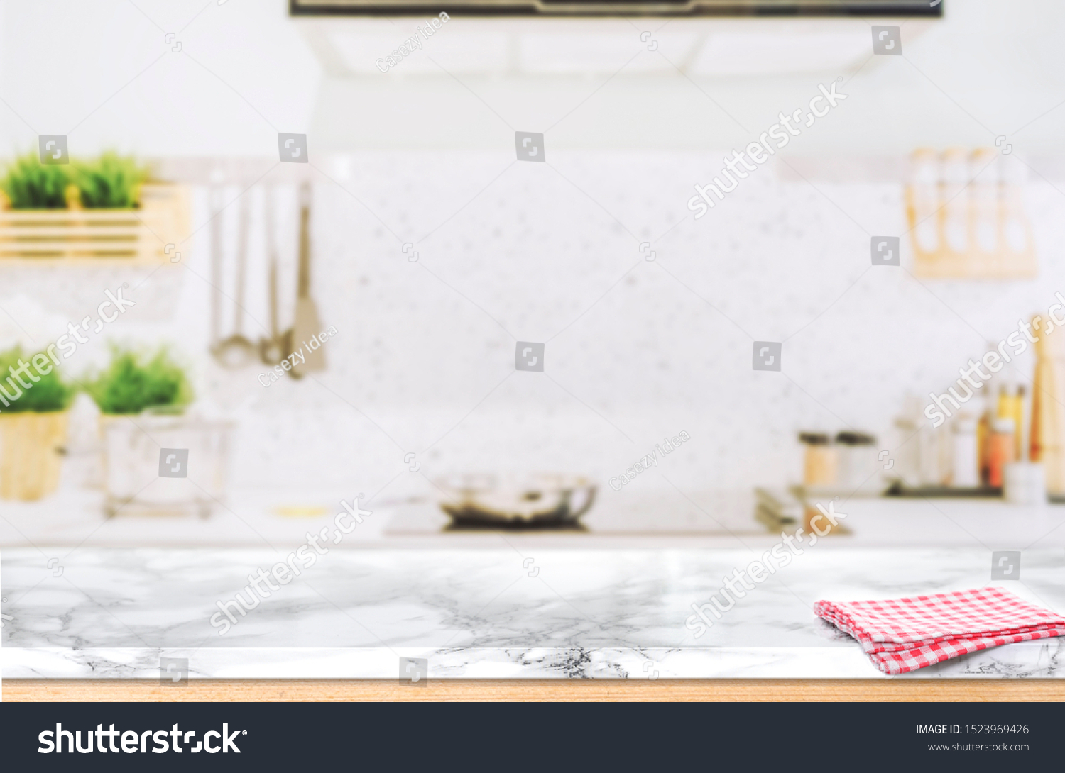 Wood table top on blurred kitchen background #1523969426