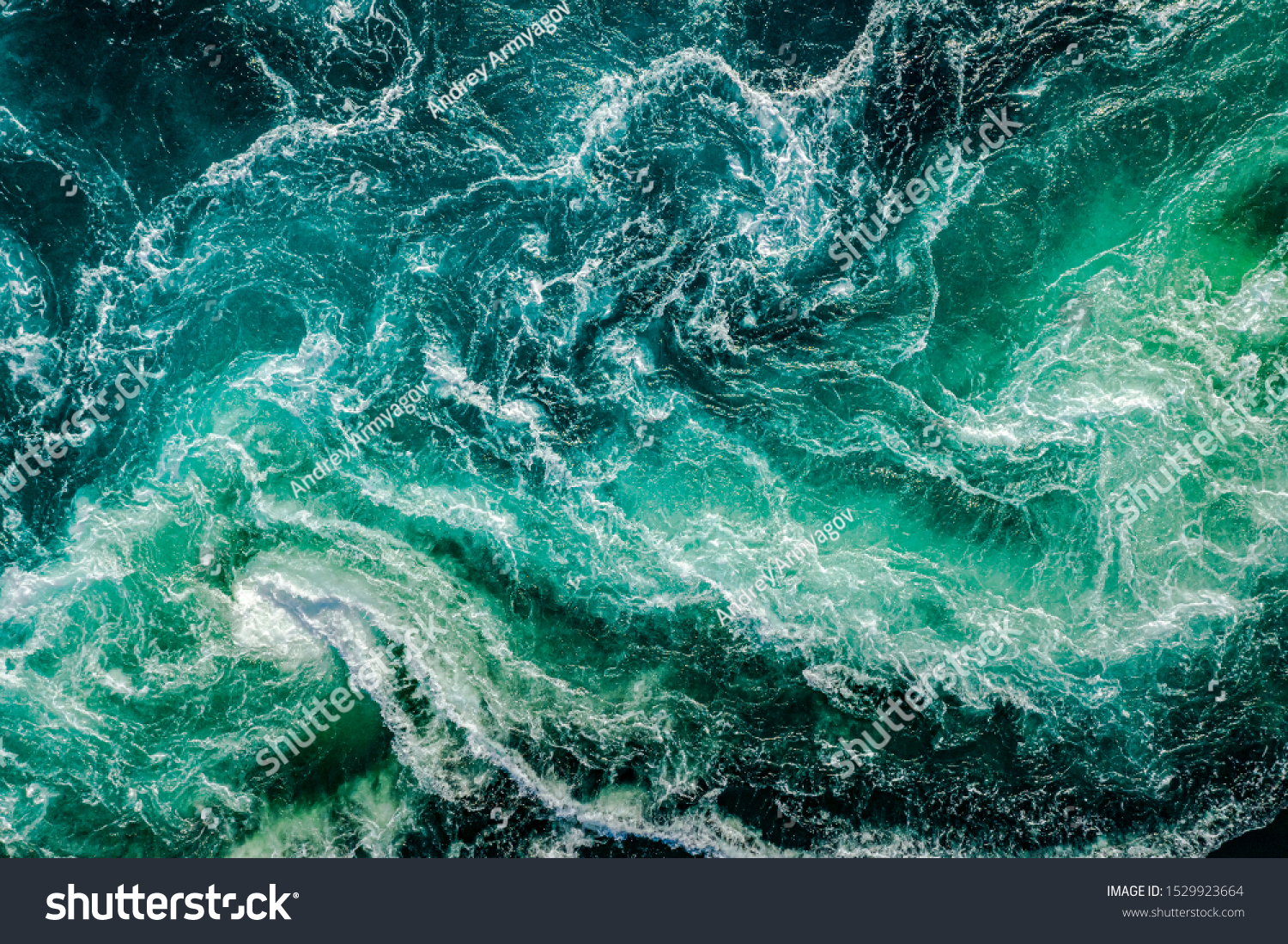 Waves of water of the river and the sea meet each other during high tide and low tide. Whirlpools of the maelstrom of Saltstraumen, Nordland, Norway #1529923664