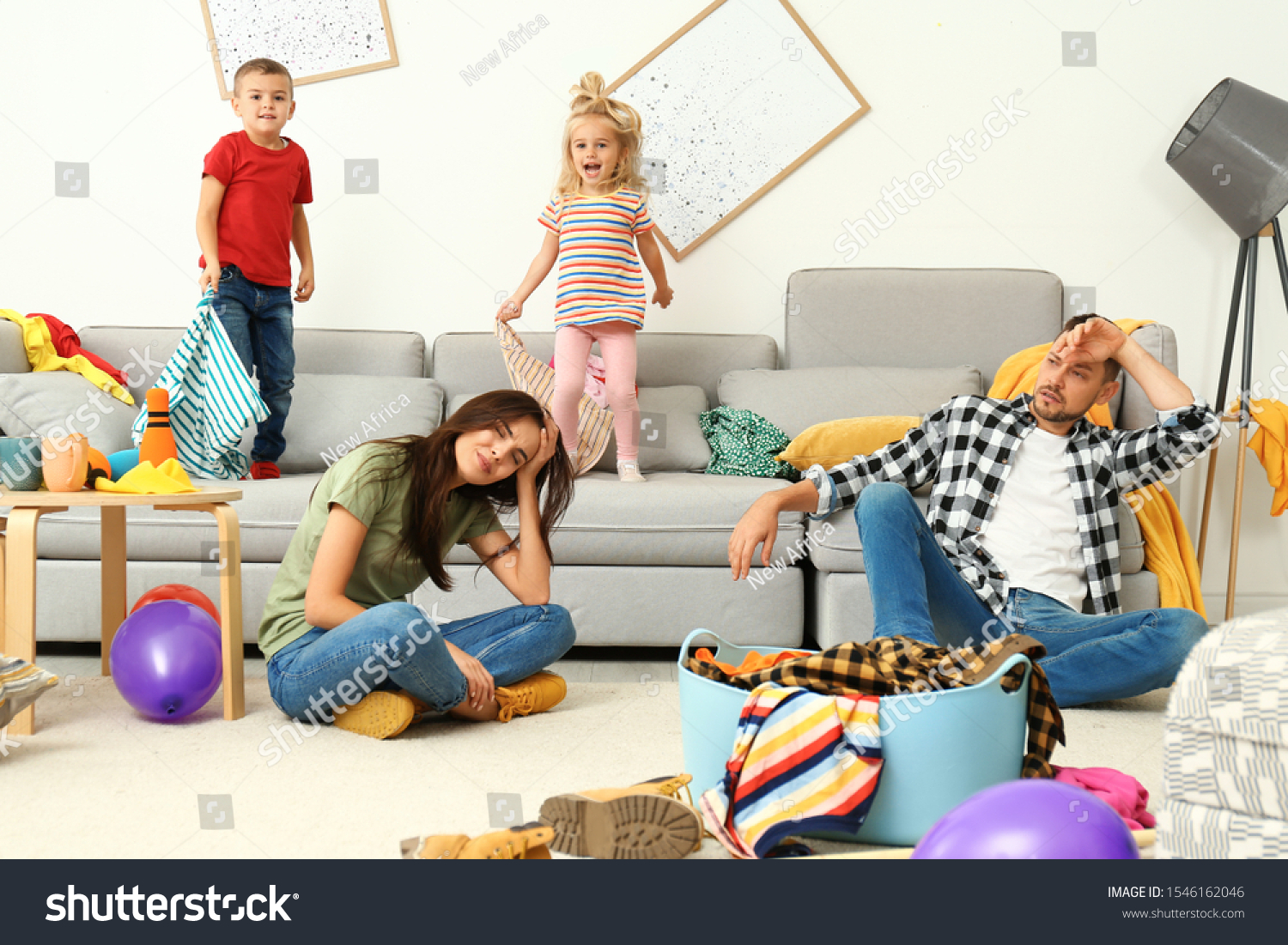 Frustrated parents and their mischievous children in messy room #1546162046
