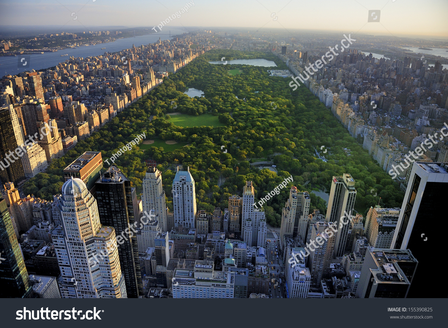 Central Park aerial view, Manhattan, New York; Park is surrounded by skyscraper  #155390825