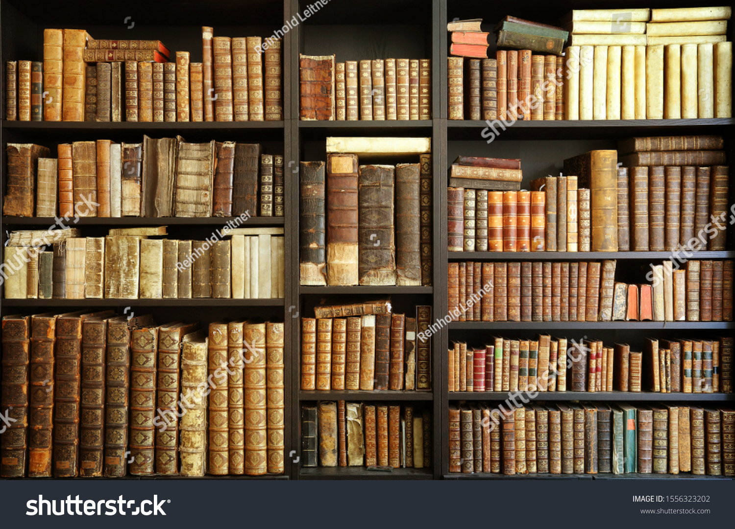 old books on wooden shelf #1556323202