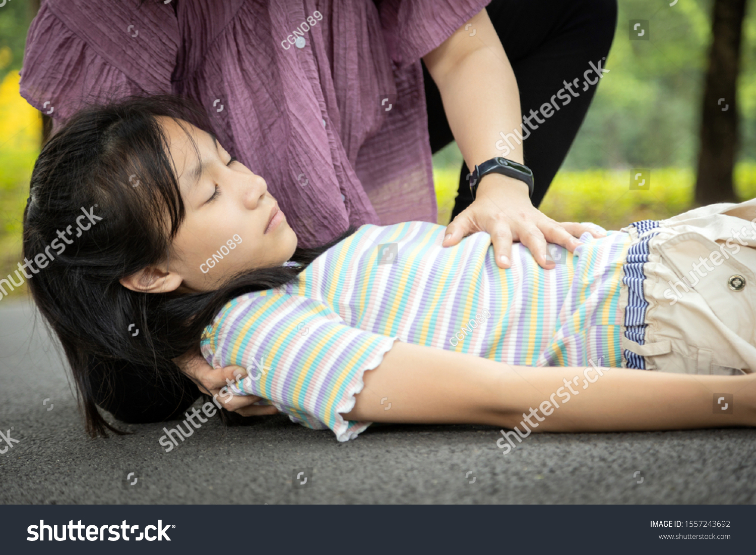 Sick daughter is fainted and fallen on floor while playing and exercise,asian mother help,take care, child girl with congestive heart failure,female unconscious fell to the ground suffer heart attack #1557243692