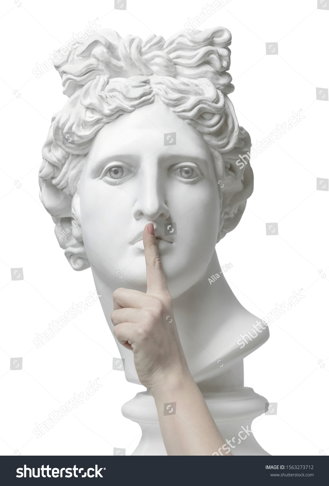 Sign of silence. Gypsum statue of Apollo's head with finger on lips. Eyes wide open. Statue. Silence. sssh. Verbosity. Quiet. Omicron. Coronavirus. Connection. Keep silence. Secret concept. Cloning #1563273712