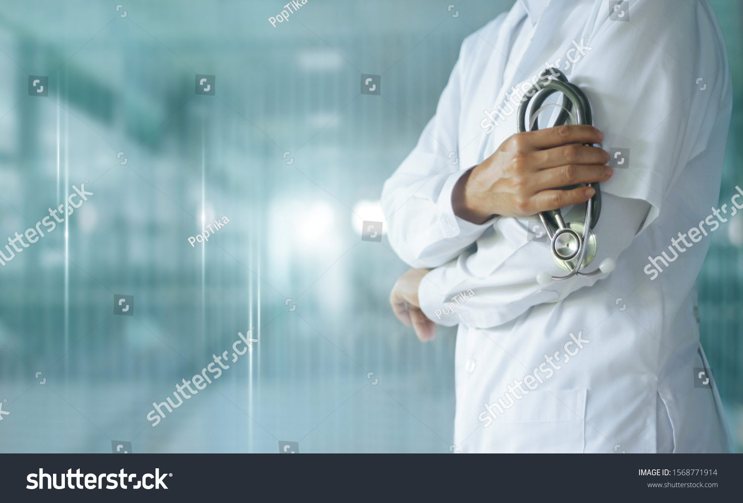 Medicine doctor with stethoscope in hand on hospital background,  Medical technology, Healthcare and Medical concept. #1568771914