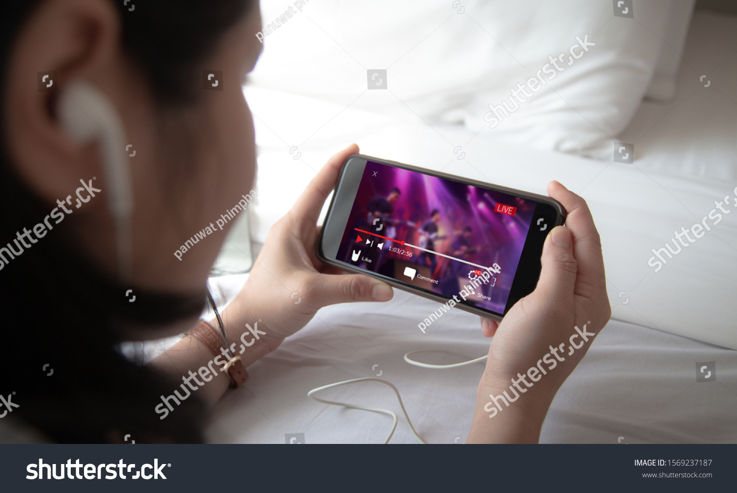 Live video streaming concept.Female hands holding mobile phone #1569237187