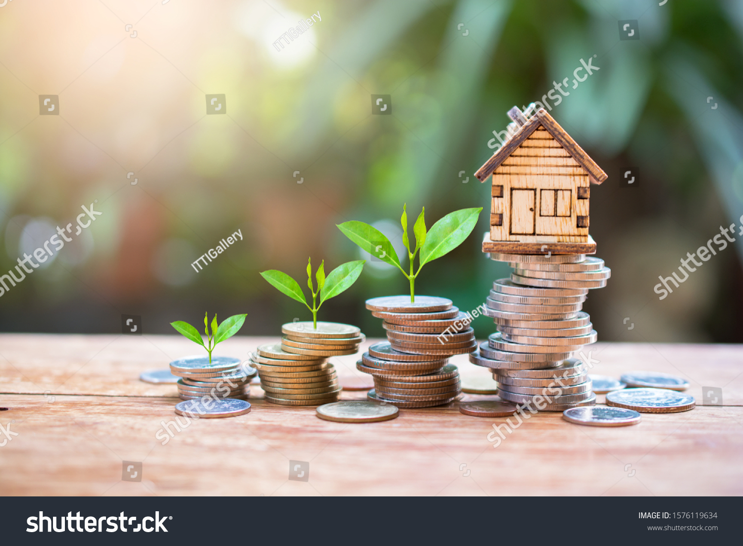 house model on money coins saving for concept investment mortgage fund finance and home loan refinance #1576119634