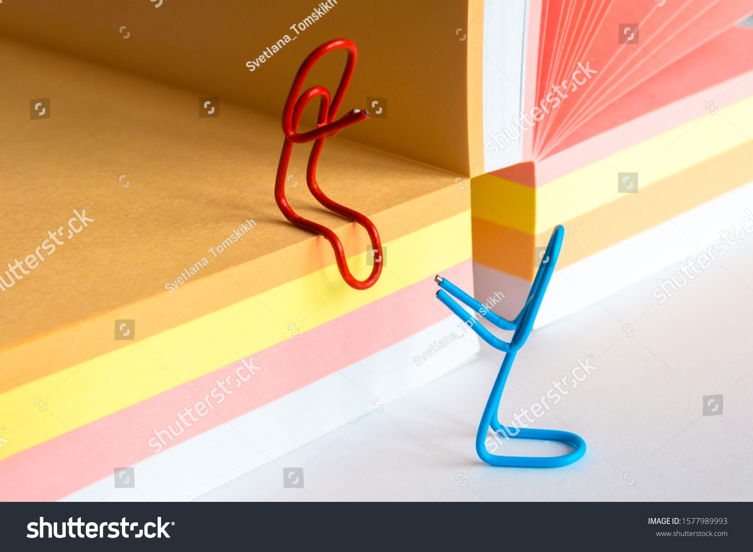 Paper Clips and Blank of Note Papers. Romantic workplace relationship concept, romance at the office concept #1577989993