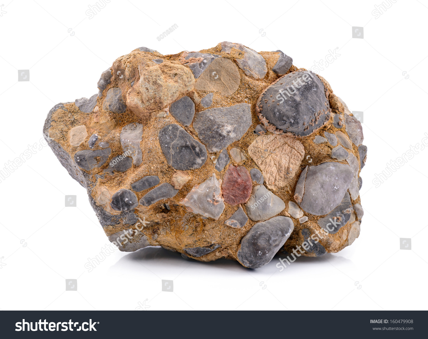 Conglomerate Close-up of a conglomerate stone isolated on white. #160479908