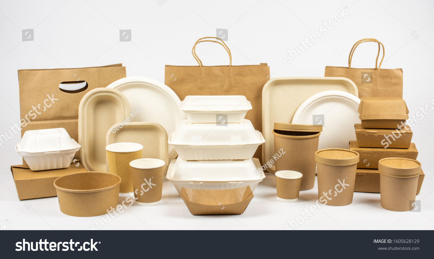 Group shot of biodegradable and recyclable food packaging on white background, paper plates, cups, containers, bags, no logos #1605628129