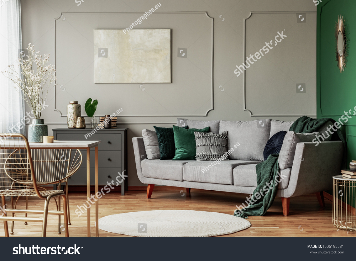 Stylish emerald green and grey living room interior design with abstract painting on the wall #1606195531