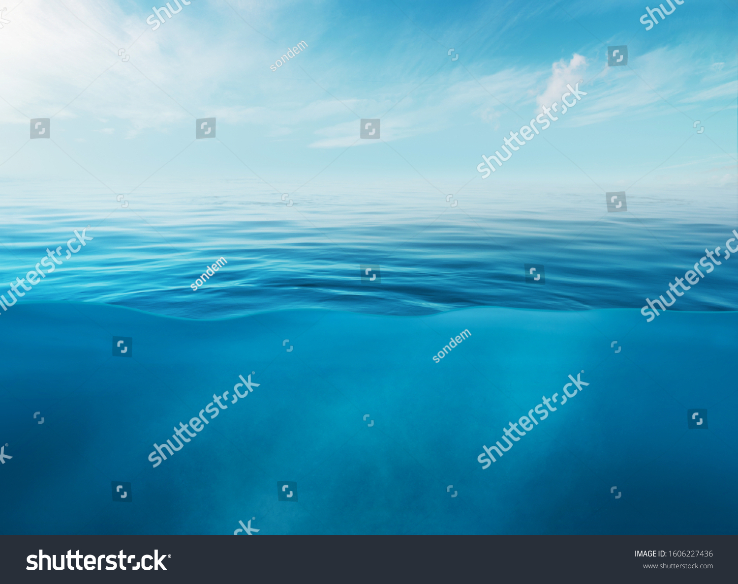 Blue sea or ocean water surface and underwater with sunny and cloudy sky #1606227436