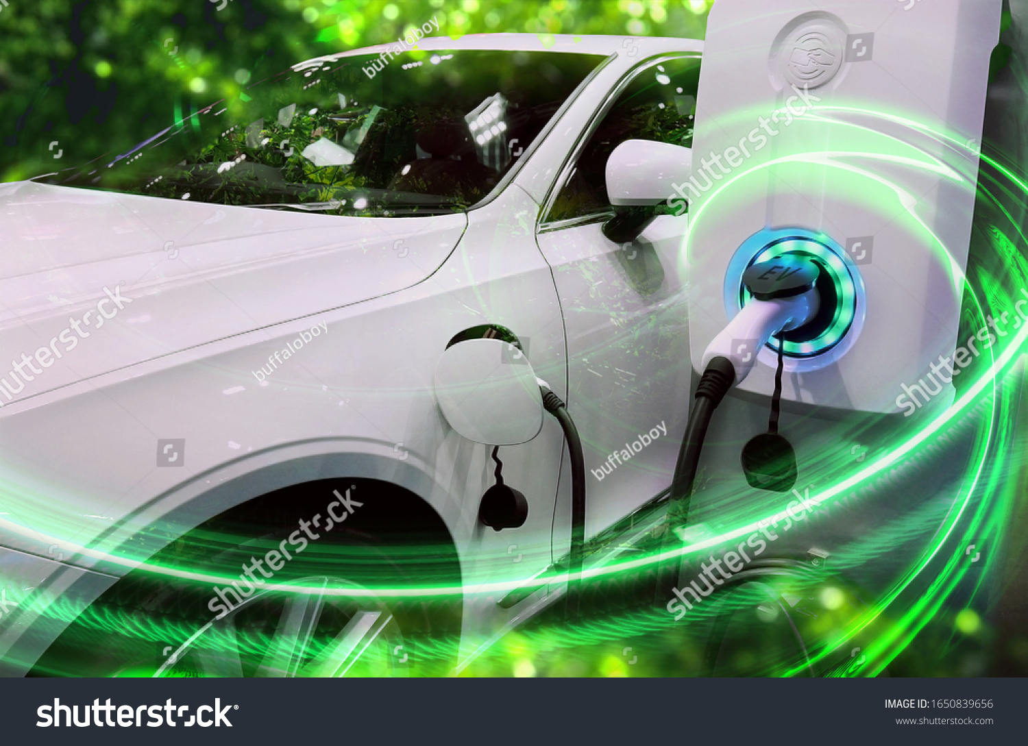 EV Car or Electric vehicle at charging station with the power cable supply plugged in on blurred nature with green enegy power effect. Eco-friendly sustainable energy concept. #1650839656