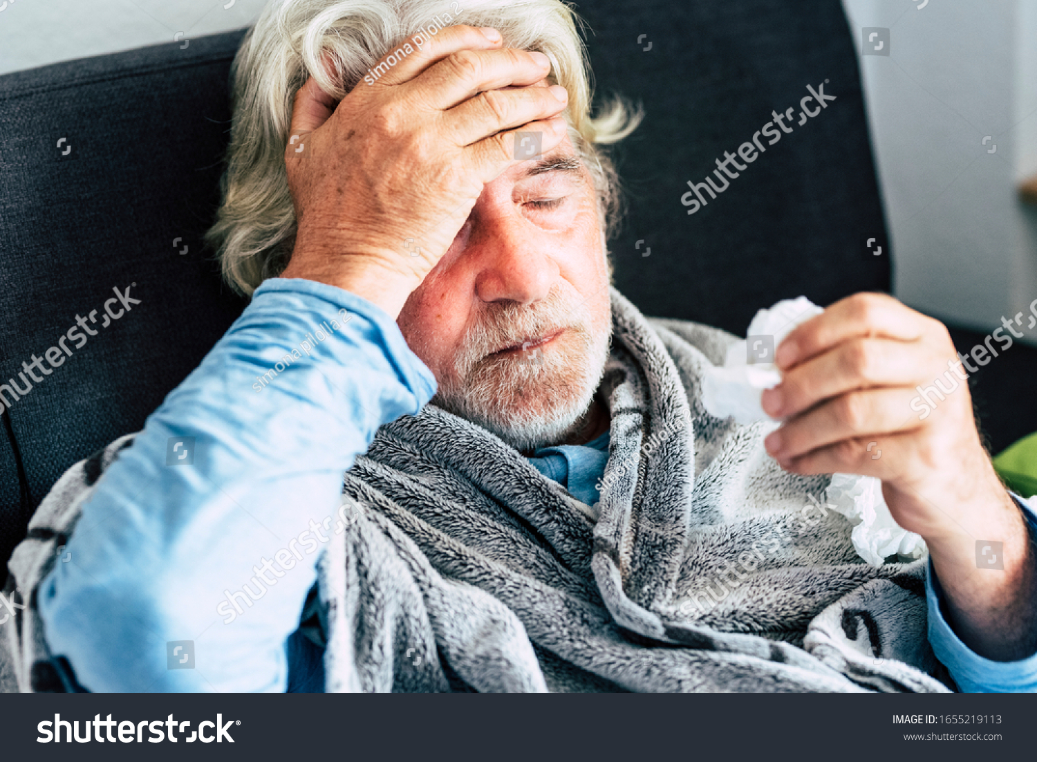 New coronavirus CoVid-19 outbreak situation with pandemic epidemic warning - adult caucasian senior old man with fever symptoms like illness cold seasonal influenza - people and virus concept #1655219113
