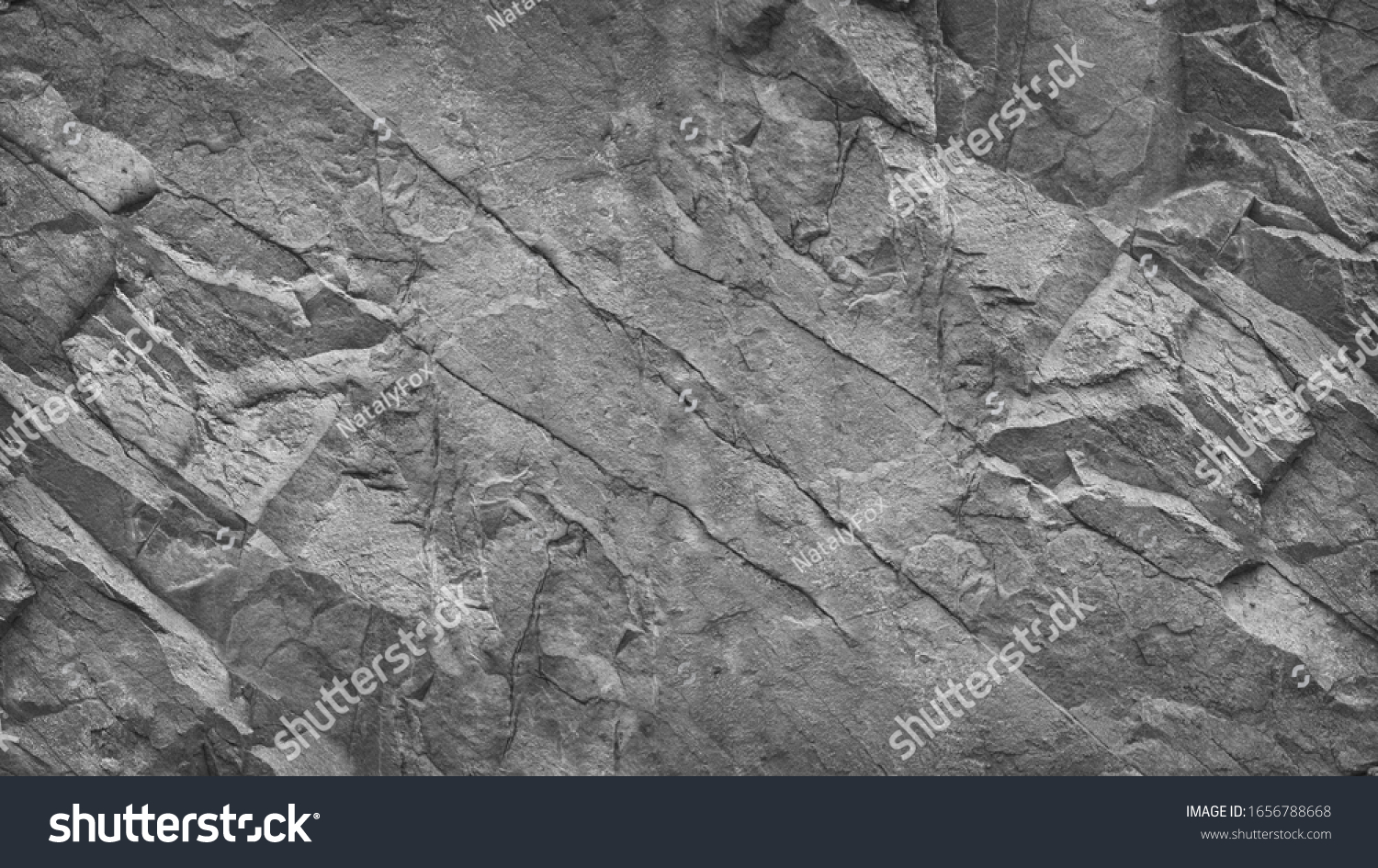Gray grunge banner. Abstract stone background. The texture of the stone wall. Close-up. Light gray rock backdrop. #1656788668