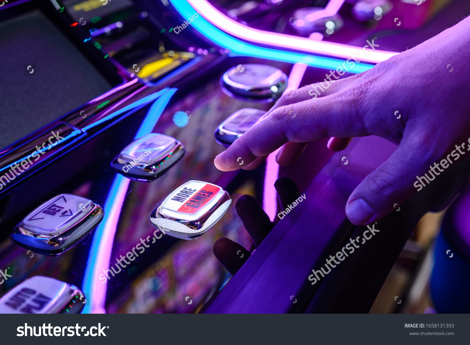 Male Playing Slot Machines In Casino. Close-up Of Male Hand #1658131393