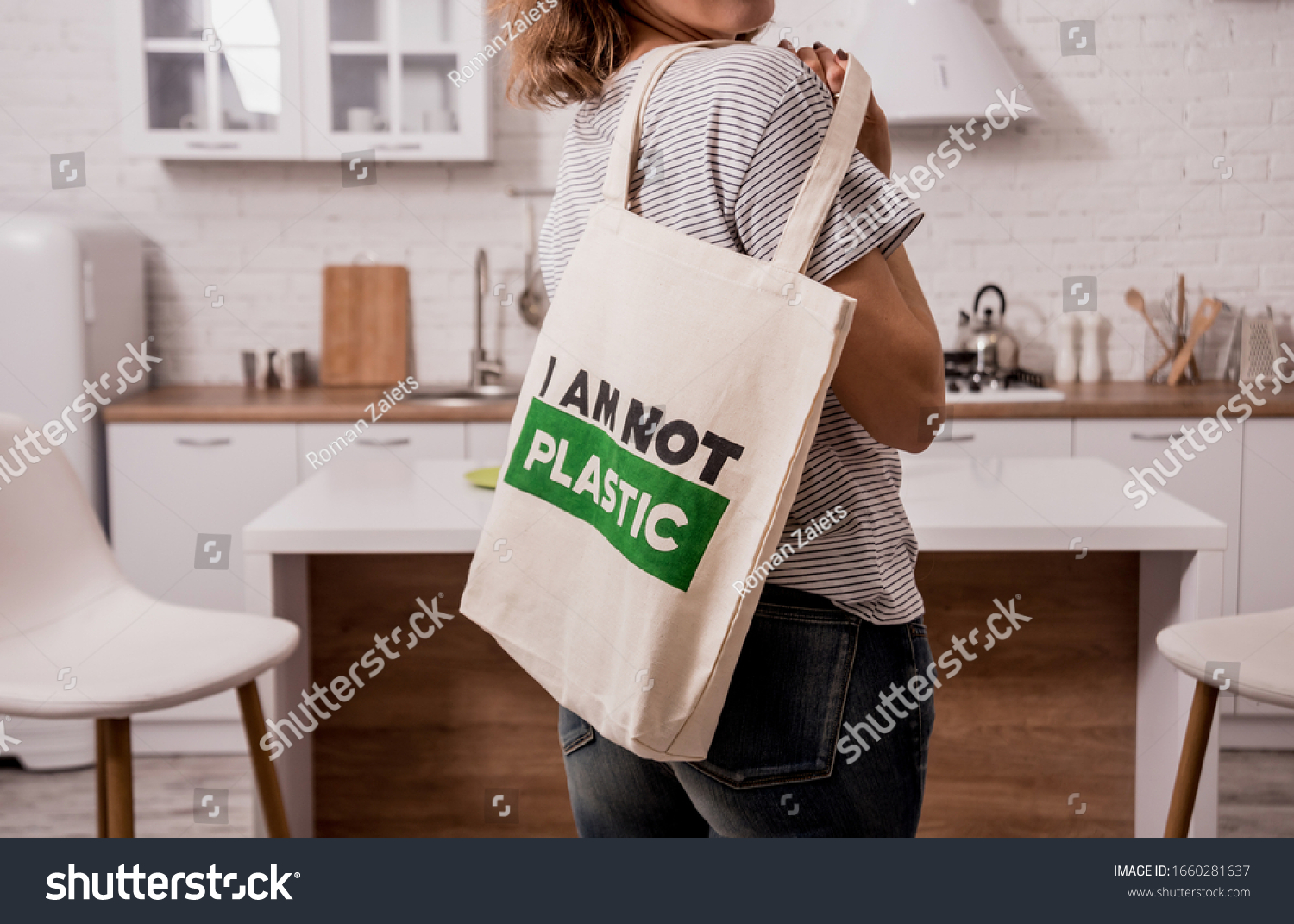 Young girl holding a cloth bag. At the kitchen. I am not plastic.  #1660281637