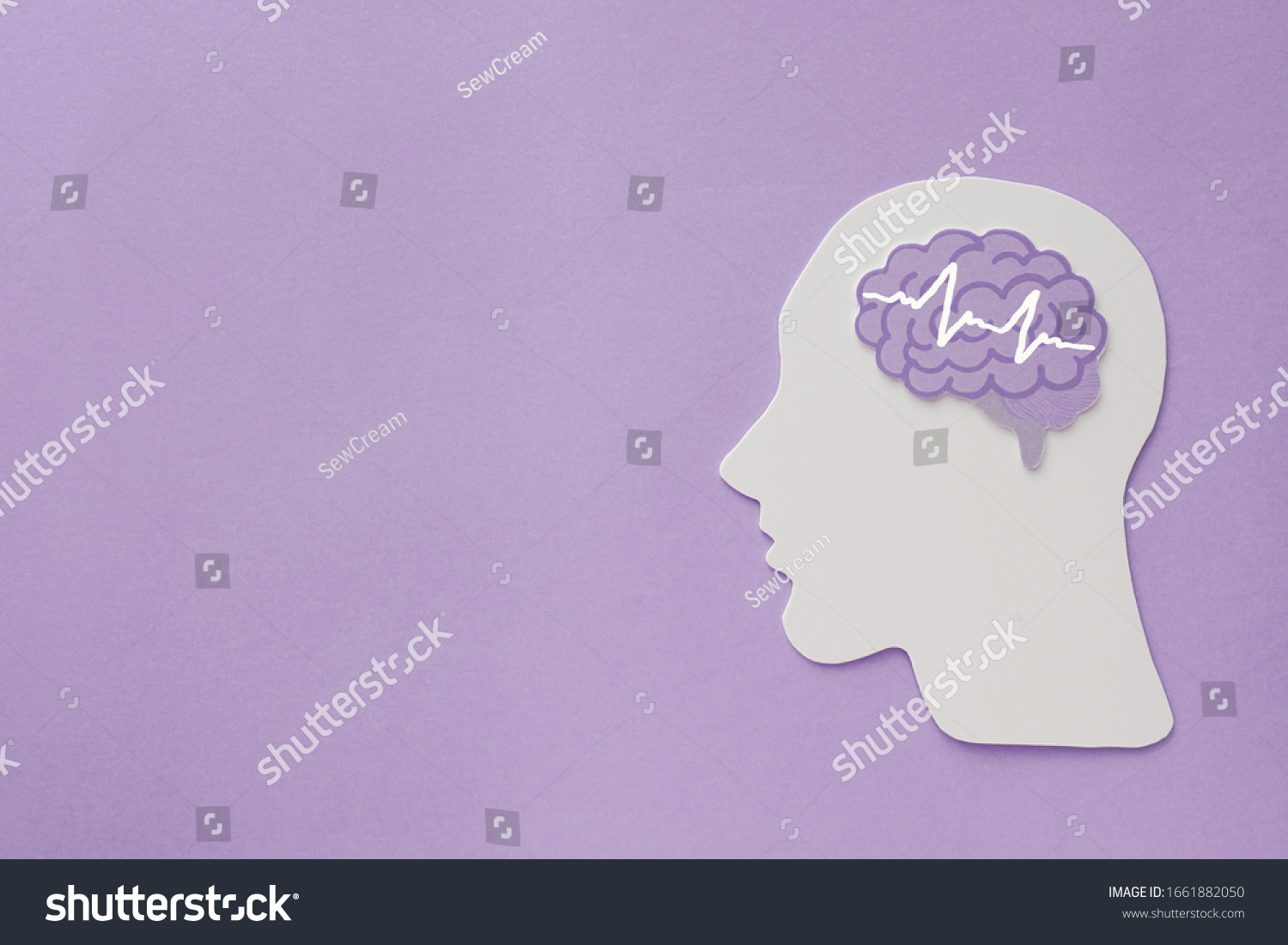 encephalography brain paper cutout on purple background,autism, Epilepsy and alzheimer awareness, seizure disorder, world mental health day concept #1661882050