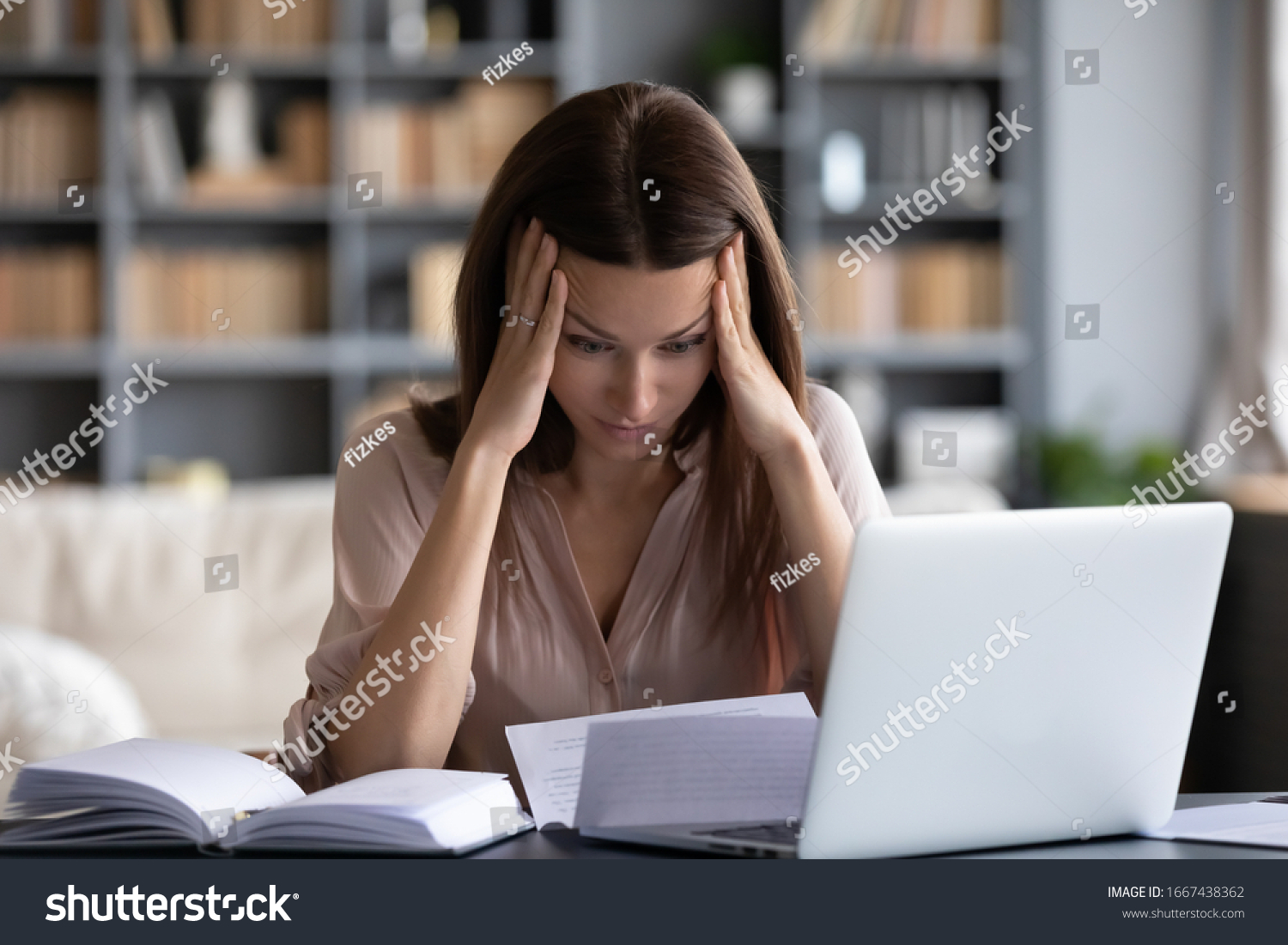Stressed young woman holding head in hands, feeling desperate about financial problems, dismissive notice, failed test. Depressed businesswoman shocked by bank loan rejection, domestic bills. #1667438362