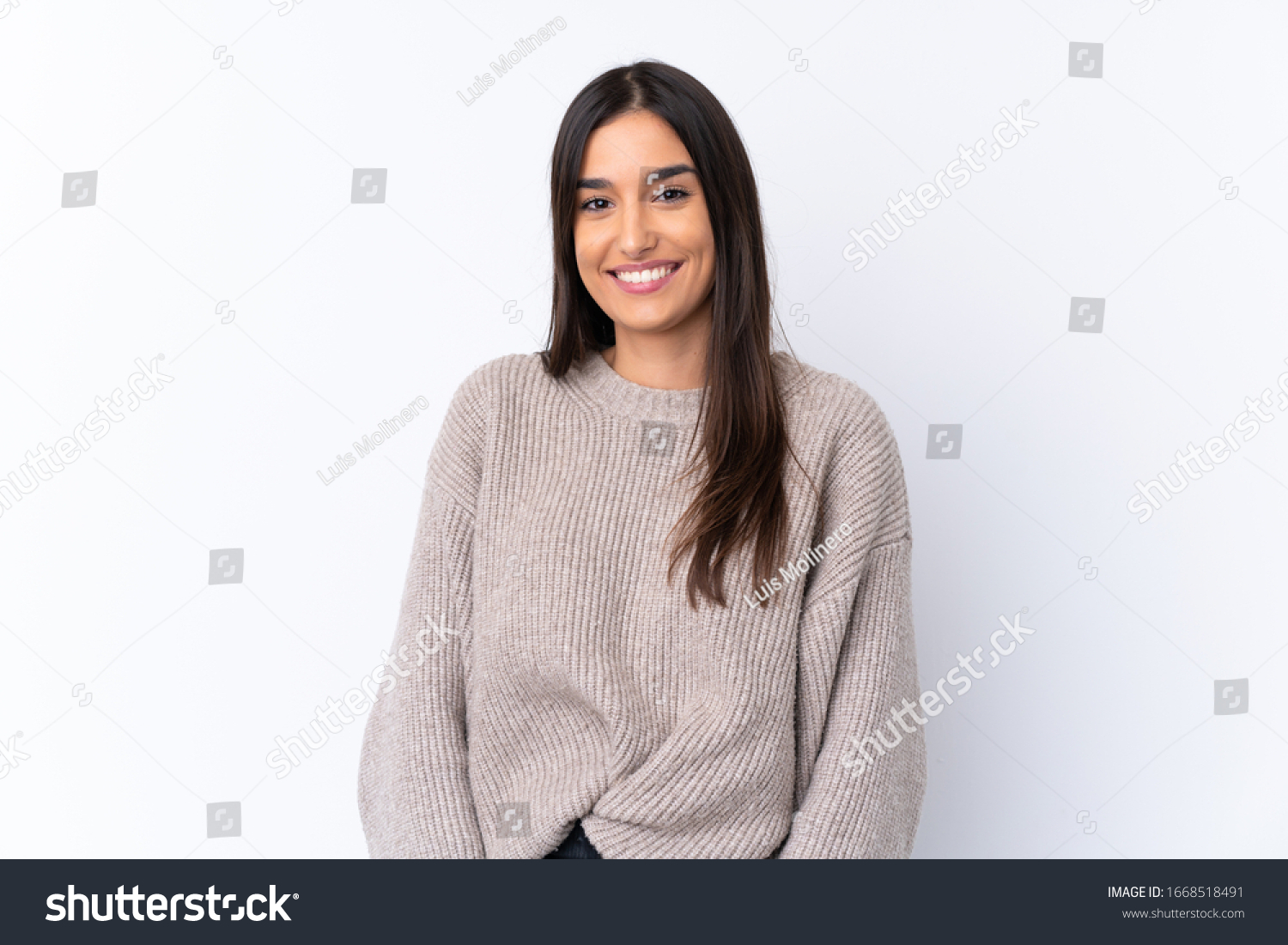 Young brunette woman over isolated white background laughing #1668518491