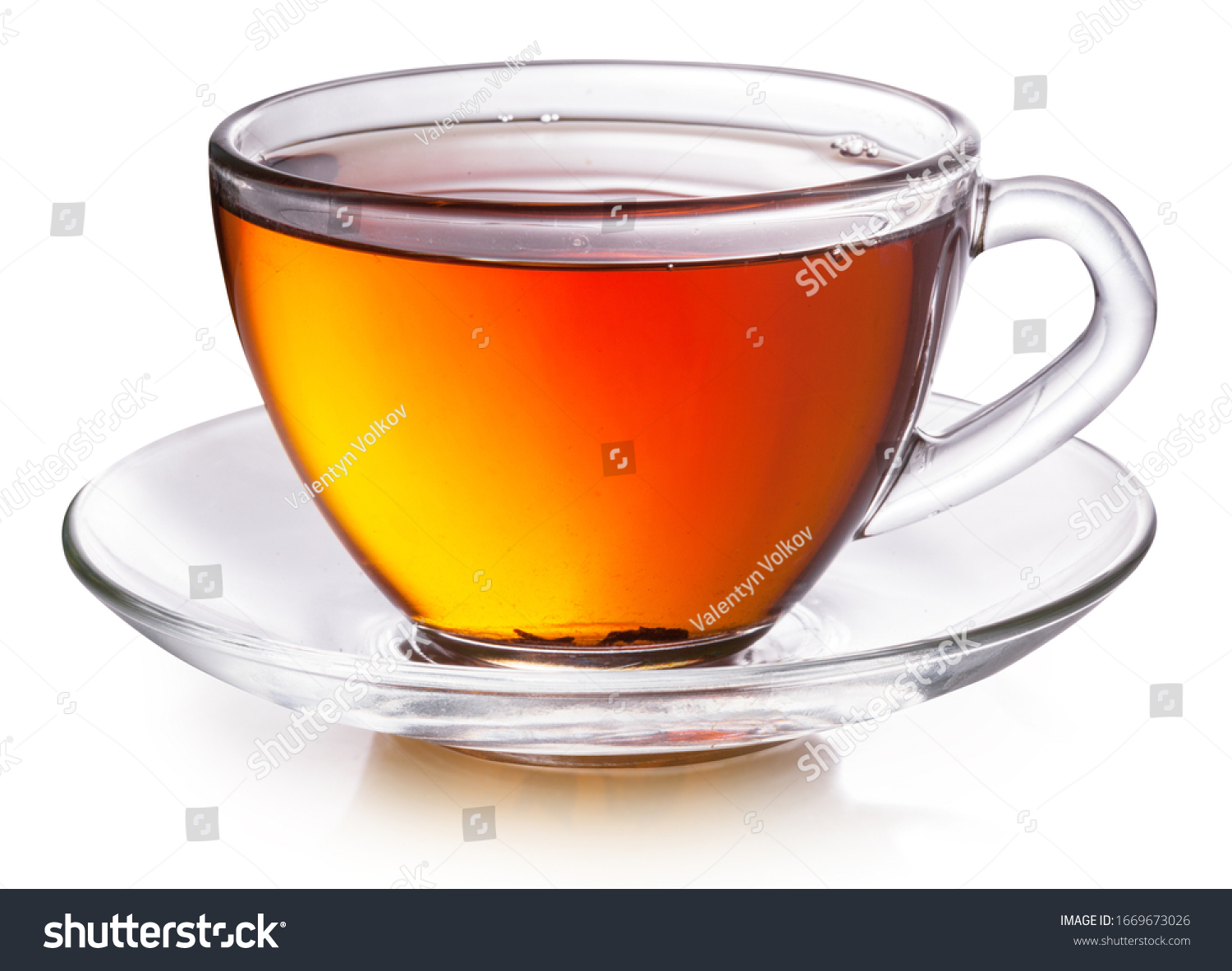 Glass cup with black tea isolated on a white background. #1669673026