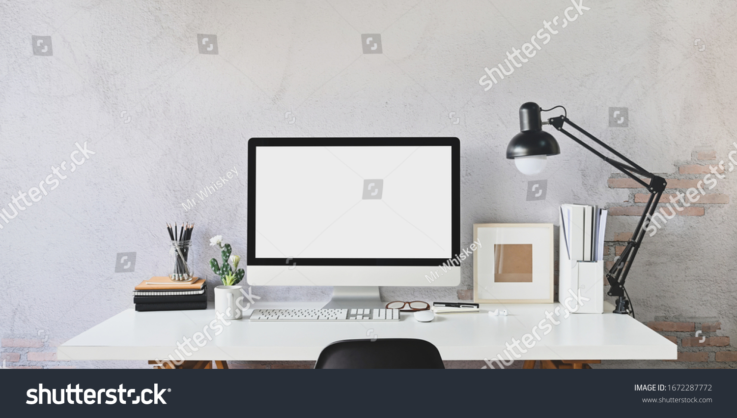 Workspace blank screen Computer and Equipment on table and loft wall background. #1672287772