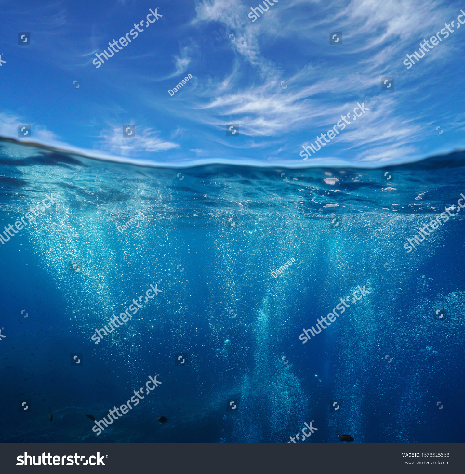 Seascape, air bubbles underwater sea and blue sky with cloud, split view over and under water surface, Mediterranean, France #1673525863