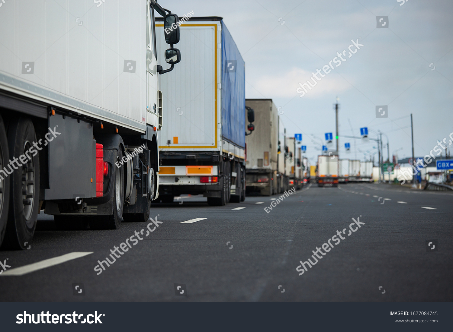 a long traffic jam of many trucks at the border , a long wait for customs checks between States due to the coronavirus epidemic, increased sanitary inspection of cargo transport #1677084745