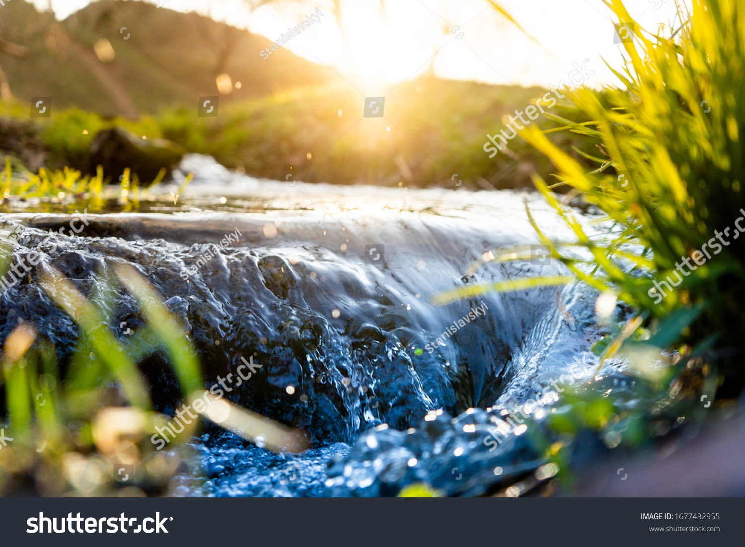 Spring background Stream of water in the forest #1677432955