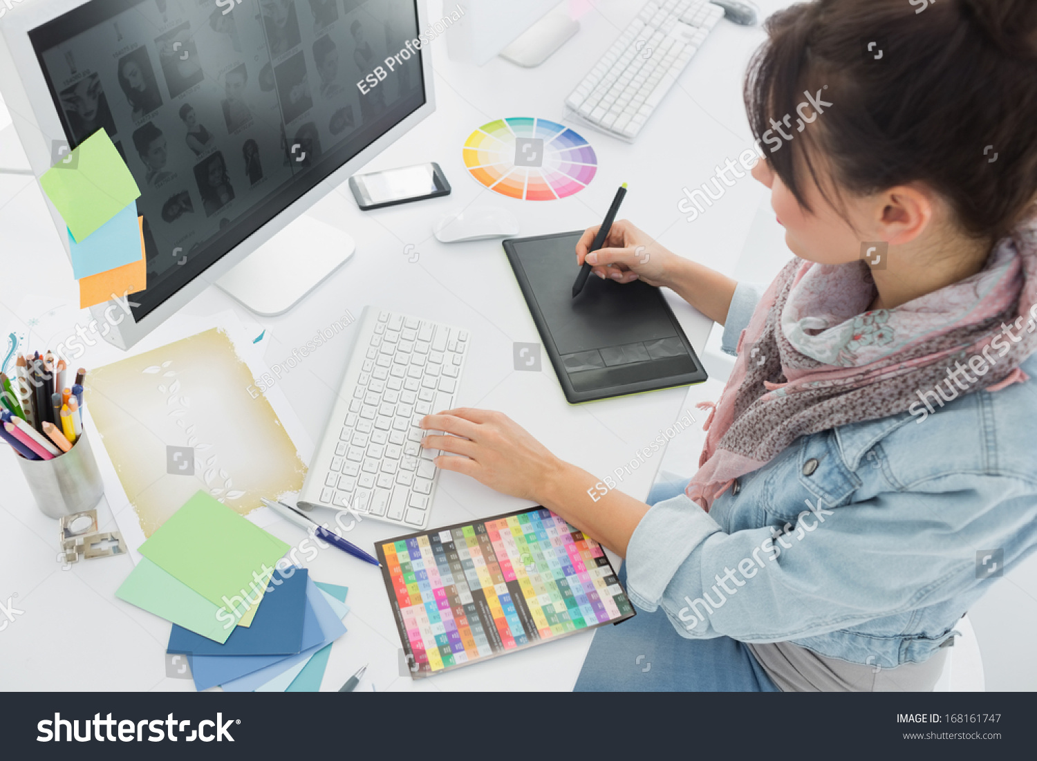 High angle view of an artist drawing something on graphic tablet at the office #168161747