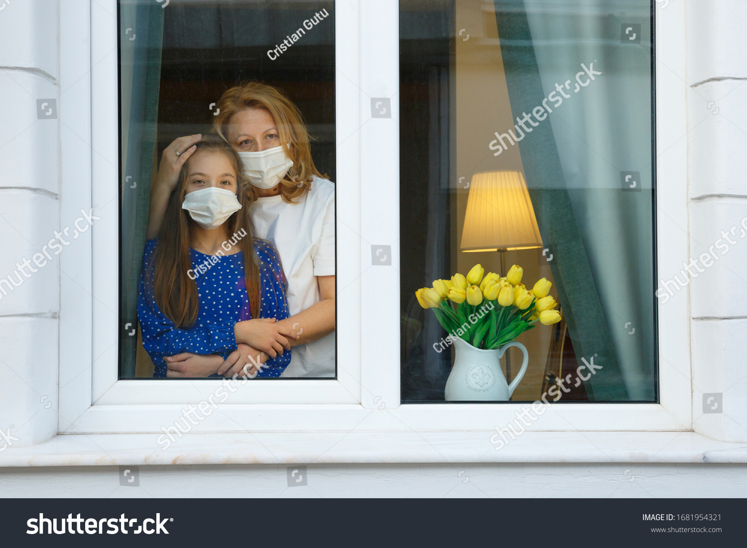 Mother and Daughter looking out for the quarantine to finish as soon as possible #1681954321