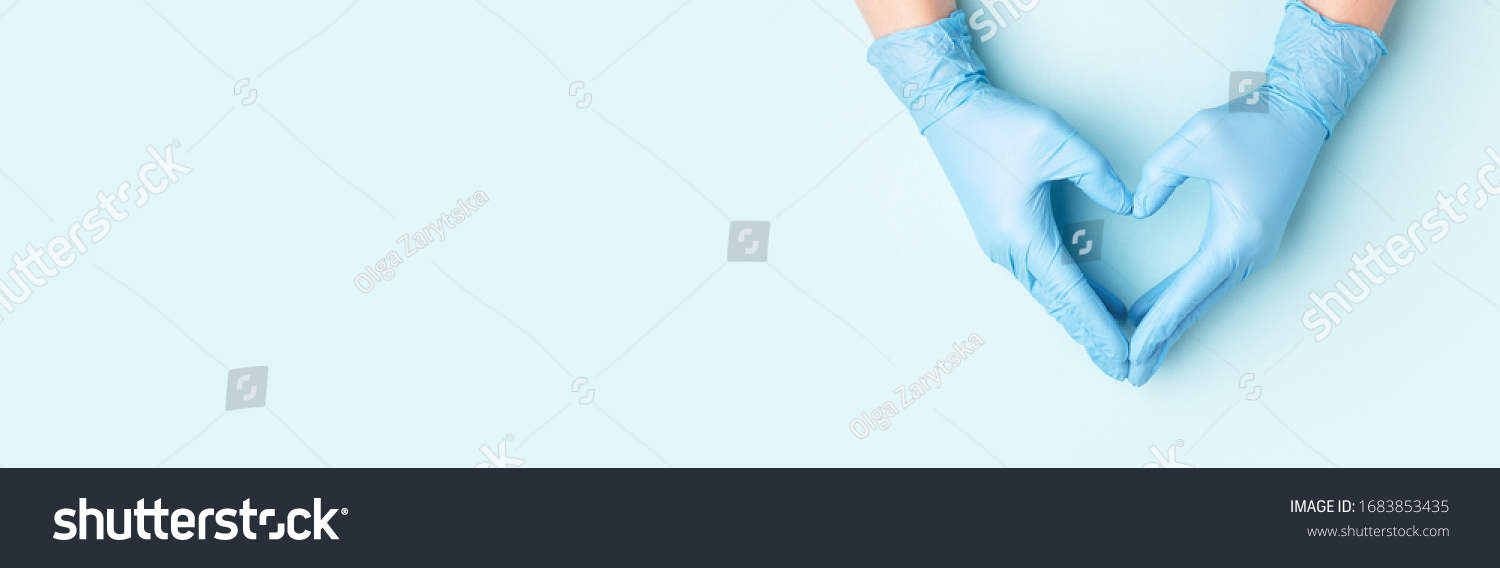 Doctor's hands in medical gloves in shape of heart on blue background. Banner for website with copy space. #1683853435