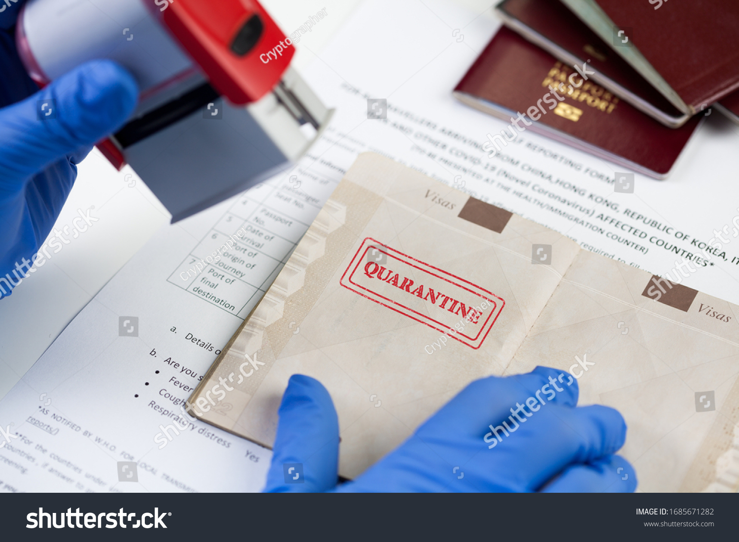 "QUARANTINE" stamped in passport, airport border customs health and safety security check,restrictive no entry measures due to COVID-19 corona virus disease epidemic,Coronavirus global pandemic, UK  #1685671282