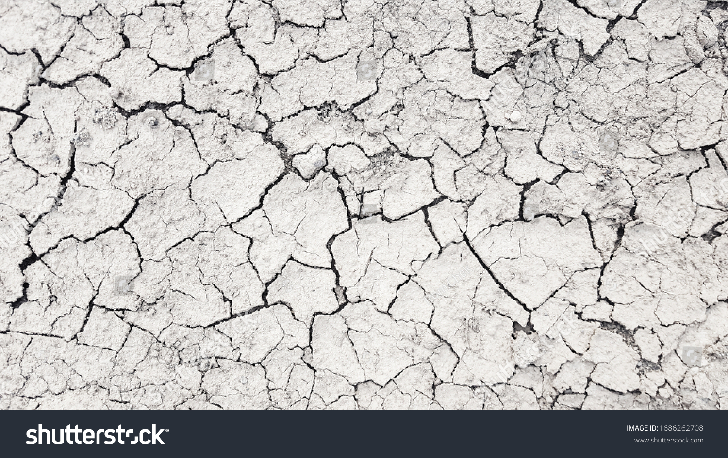 Dry mud cracked ground texture. Drought season background #1686262708
