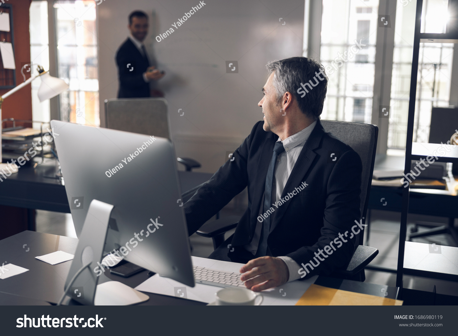 Busy boss is preparing for meeting in office stock photo. Business concept #1686980119