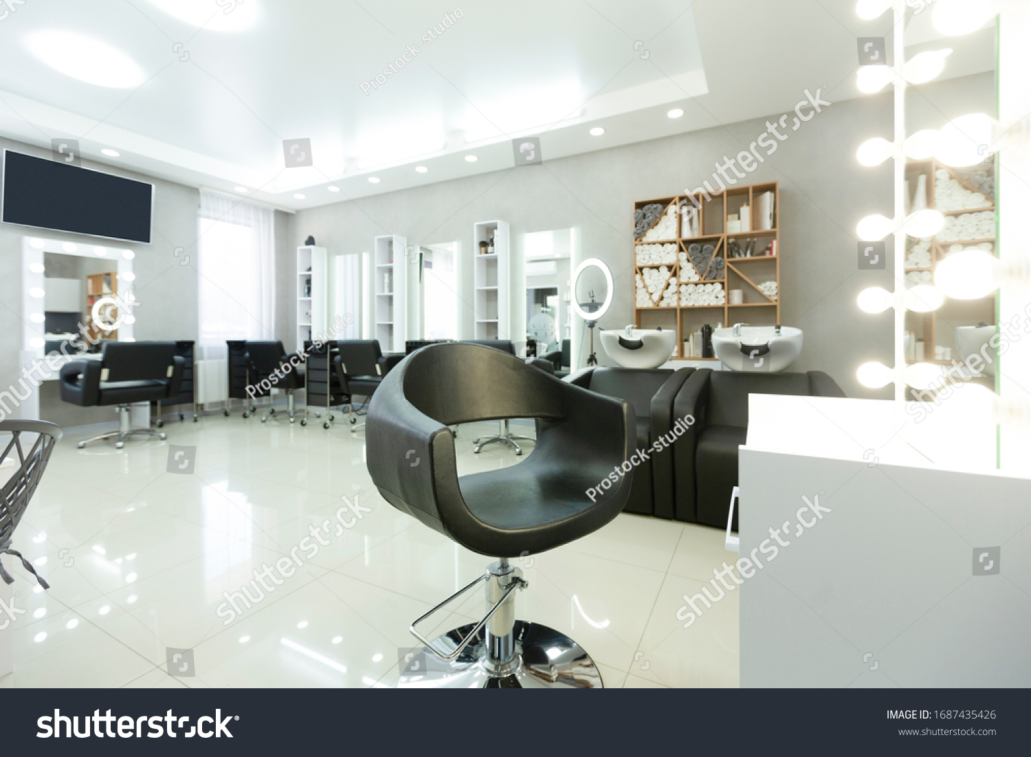 Modern empty hair saloon with chairs and mirrors, free space #1687435426