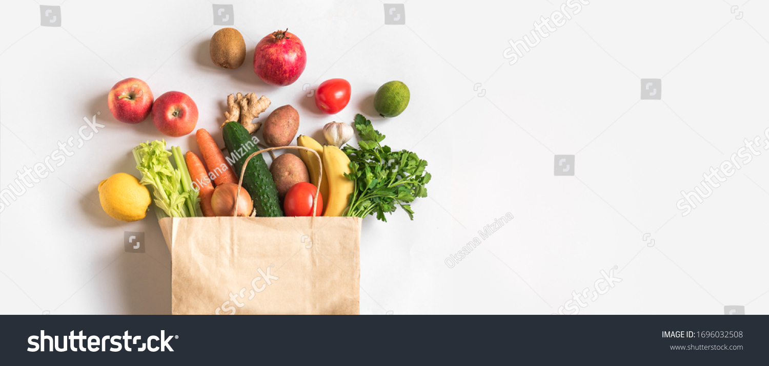 Delivery healthy food background. Vegan vegetarian food in paper bag vegetables and fruits on white, copy space, banner.Grocery shopping food supermarket and clean vegan eating concept. #1696032508