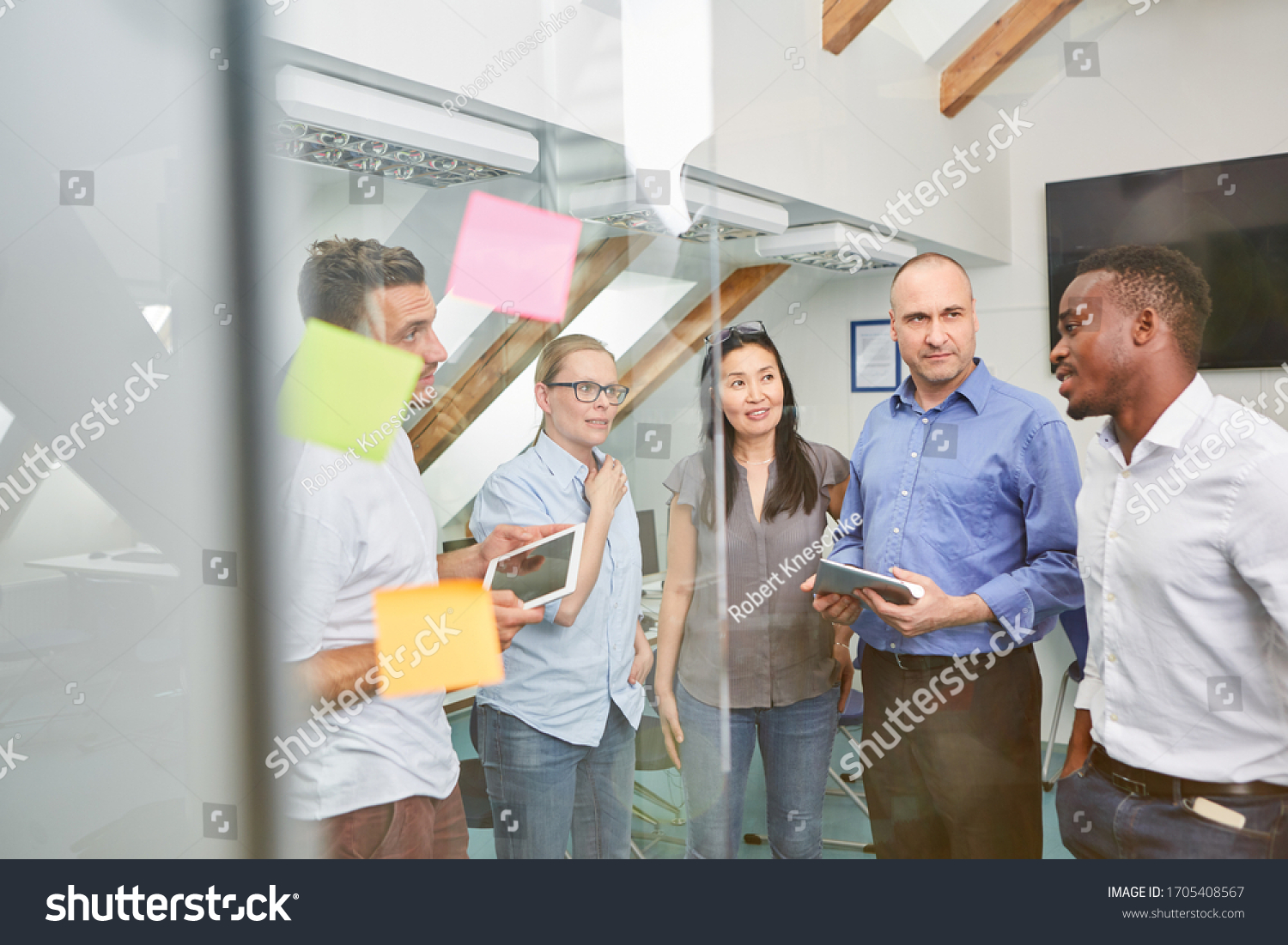 Multicultural business team in a meeting or brainstorming in the office #1705408567
