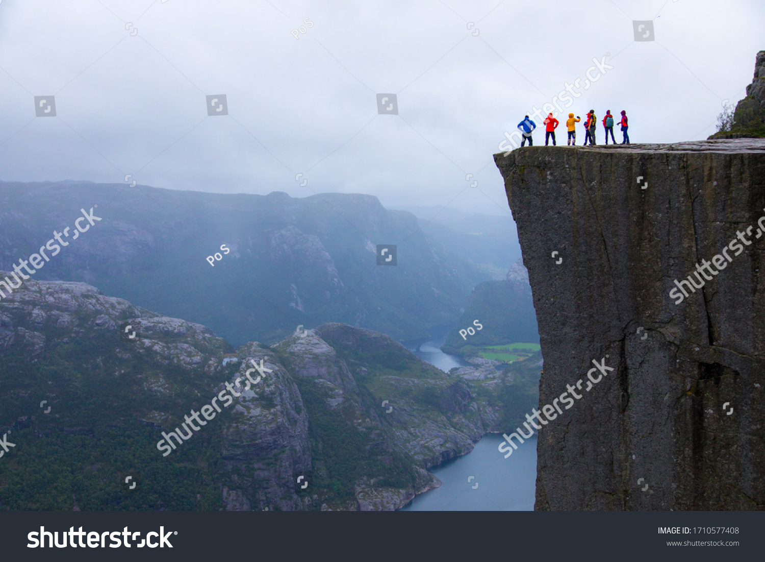 Majestic Preikestolen over Lysefjorden, Stavanger, Norway. Famous hiking trail and spot to enjoy the view over Norwegian fjord and mountain. #1710577408