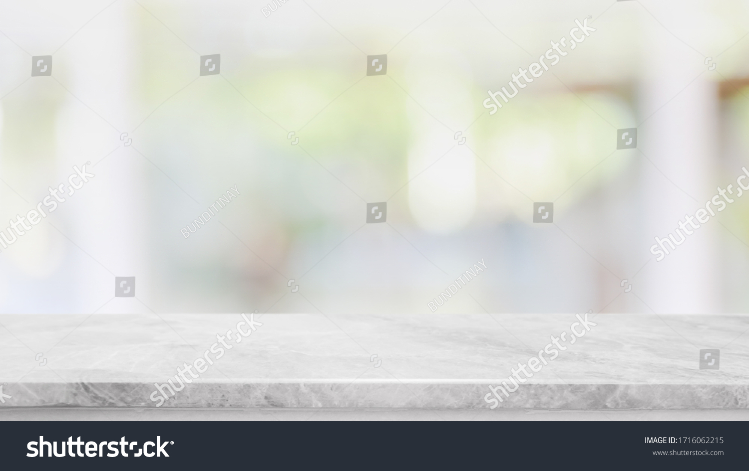 Empty white marble stone table top and blur glass window interior cafe and restaurant banner mock up abstract background - can used for display or montage your products. #1716062215
