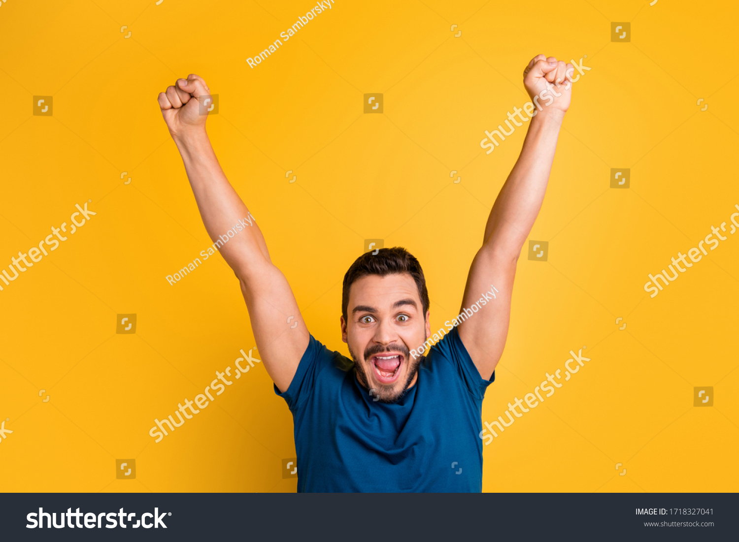 Close-up portrait of his he nice attractive glad overjoyed cheerful cheery guy celebrating raising hands up having fun isolated over bright vivid shine vibrant yellow color background #1718327041