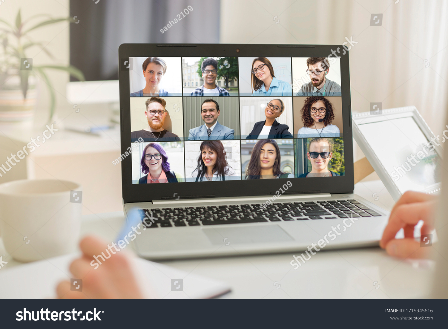 Online conference of colleagues through a laptop. Video call for training. Educational webinar chat between different people. Team meeting. #1719945616
