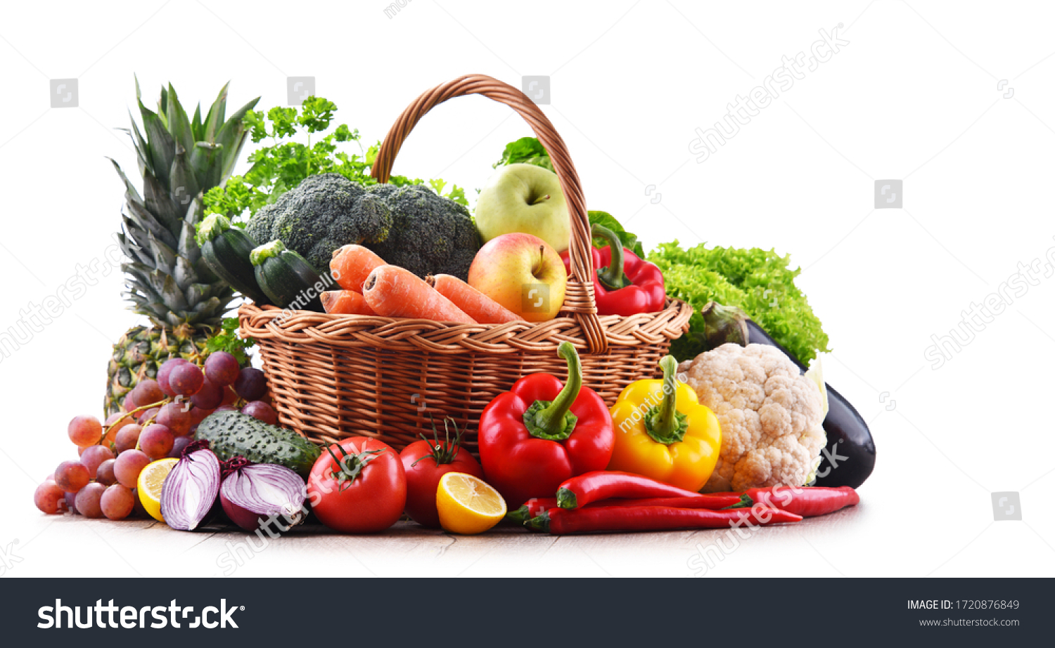 Assorted organic vegetables and fruits in wicker basket isolated on white background. #1720876849